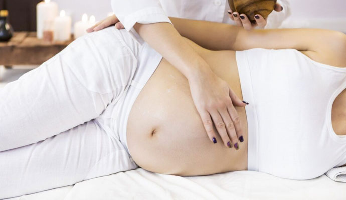 Picture of a woman receiving a pregnancy massage